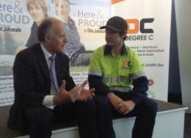 Minister Abetz with Jessie, a new employee as a result of the Advocate's Here and Proud Campaign. Image credit: Minister's Media Centre