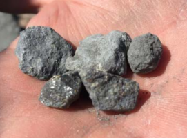 Discovery RC drill chips with fresh sulphide rich mineralisation including sphalerite (Zn) and galena (Pb) Image credit: De Grey Mining ASX release